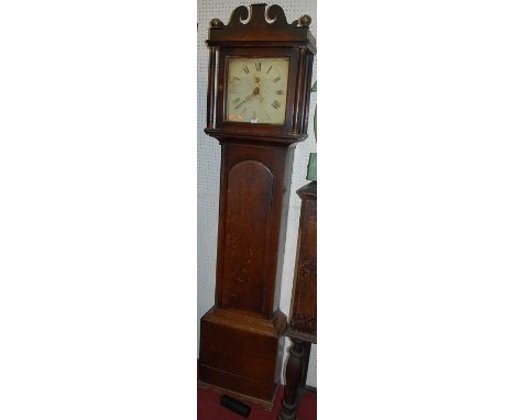 A circa 1800 provincial oak long case clock, having a painted enamel square dial with 30 hour weight driven movement, with pe
