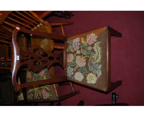 A pair of 19th century mahogany Chippendale style dining chairs, each having floral tapestry upholstered drop-in pad seats