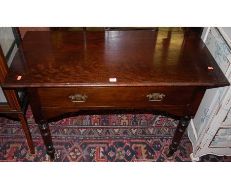 A late Victorian mahogany single drawer side table, raised on ring turned supports, w.106.5cm 