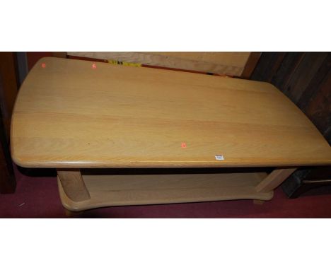 A contemporary light oak two-tier coffee table, length 135cm