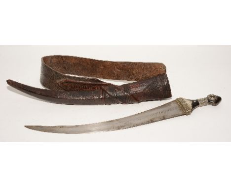 A rare 19th century Saudi Arabian Dharia shortsword, the horn hilt with white metal decoration bending above curved blade, in