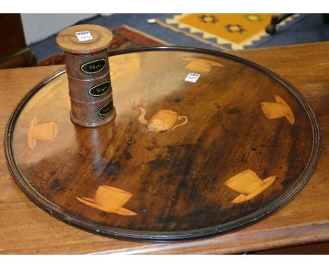 A George III mahogany circular table top, decorated with satinwood inlaid panels of tea cups on saucers to the border, teapot