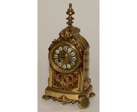 A French brass mantel clock, the dial with enamel Roman numeral indicators, stamped BR to back plate, the movement striking o