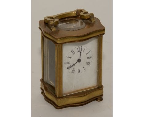 A brass carriage clock, with single train movement, with key, one foot lacking, 14cm high
