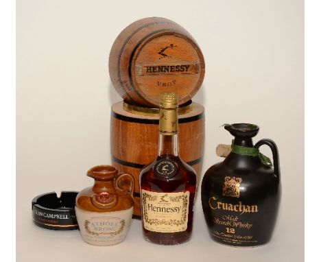 A Cruachan 12 years old malt scotch whisky in black pottery flagon, 26¾ fl.oz, 75 % proof, also with Hennessy Very Special co