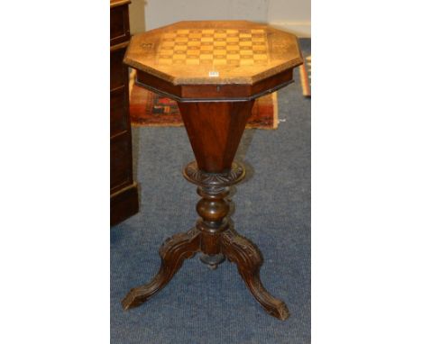 A Victorian sewing/games table, the octagonal hinged top with inlaid chess board decoration, enclosing jade coloured pieces, 