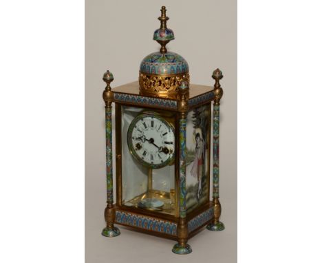 A modern French style mantel clock, with enamel and pierced gilt metal urn to the top above white enamel dial with Roman and 