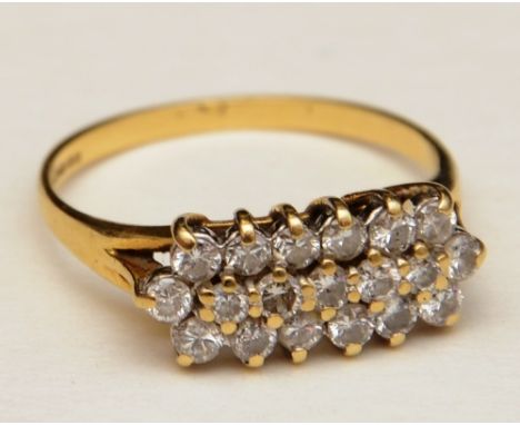 An 18ct gold and diamond dress ring, with 19 brilliant cut diamonds across three rows, approx. 0.50ct in total, set in basket