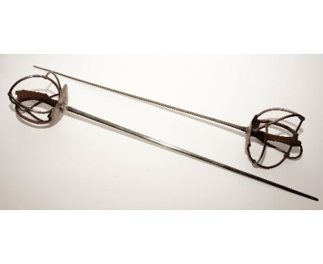 A pair of Schlager German duelling swords, engraved to K Heinick, with wire grip, and tapered blade, blade 85cm long