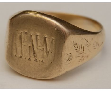 A gents gold signet ring, hallmarks rubbed, monogrammed WNM to cartouche with foliate detail to shoulders, ring size V, 10.6g