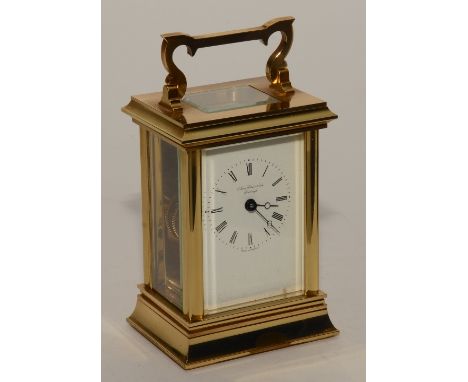 A brass carriage clock signed by James Ritchie & Son Edinburgh, visible single train movement, 17cm high, with key and outer 