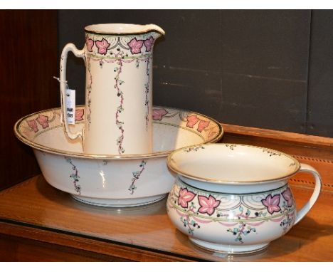 A late Victorian Burleigh Ware three piece pottery toilet set, comprising of ewer, basin and chamber pot, decorated with berr