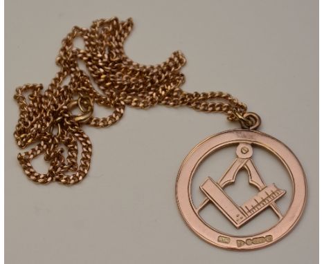 A 9ct gold Masonic pendant, with compass set square set in foliate engraved circle, stamped 375 to underside and to clasp, 9.
