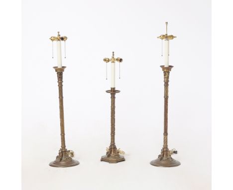 First half 20th centuryEach on circular base with dolphin supports; Together with Another Similar Example. Height of pair 30 