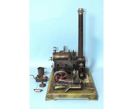 An early-20th century live steam stationary engine, the spirit-fired horizontal boiler fitted with pressure gauge, weighted s