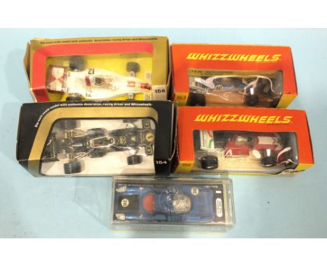 Dinky, 210 Alfa Romeo 33 Tipo Le-Mans (metallic blue) and four Corgi racing cars, (all boxed). 
