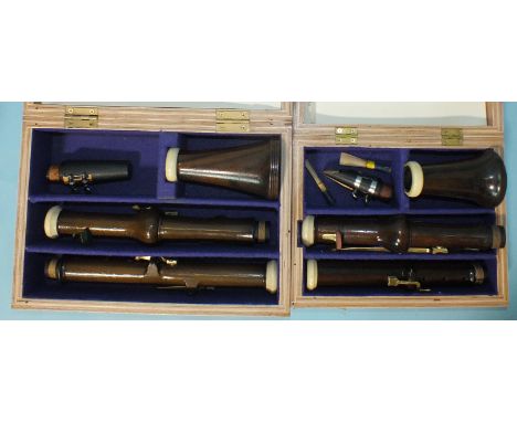 A rosewood classical clarinet in A, with brass keys and another, similar, in A, (both boxed), (no makers' names), (2). 