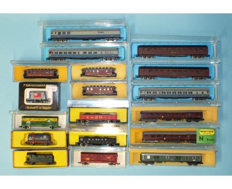 N gauge, eleven boxed coaches and seven boxed wagons by Atlas, Bachmann, Life-Like, Minitrix, Graham Farish and others, (18).