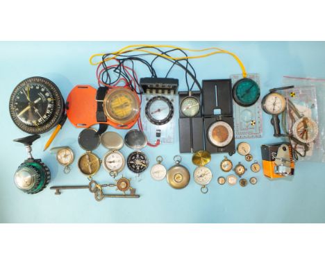 A Suunto Co. type K-15 compass, a collection of various pocket and fob compasses, etc. 