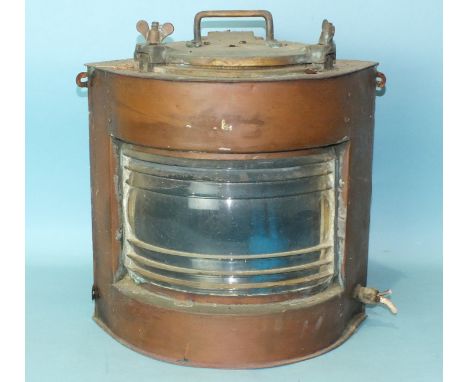 A copper and brass ships lamp, converted for electricity, 43cm high. 