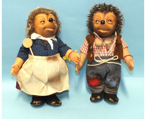 Steiff, a pair of hedgehogs: Mecki with pipe, button and wrist tag and Micki with spoon, button and wrist tag, both 26cm high