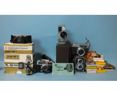 A Zenith E f2 camera, cased and boxed, a Canonet A4 28, a Kopil Electric Eye, cased with instructions, a Minolta Hi-Matic 7, 