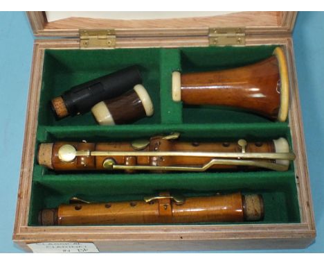 A classical boxwood and ivory clarinet in B?, with brass keys and rosewood barrel, stamped Bilton, London and Potter, King St