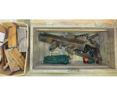 A collection of wooden moulding and other planes, tools and a wooden tool box.