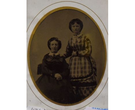 19th Century, two ambrotype photographs of American people, displayed in burr wood frames, within oval mounts, and under glas