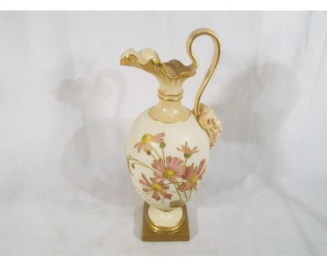 Royal Worcester - an early 20th century large ure / jug, decorated  in a floral design on a blush ivory ground with gilded ac