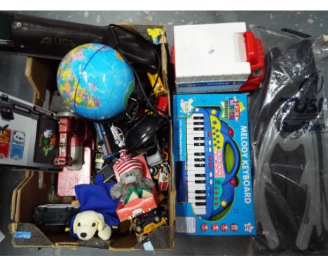 A good mixed lot to include a Melody keyboard, an auto recorder, diecast model cars including Matchbox, a pair of flippers an
