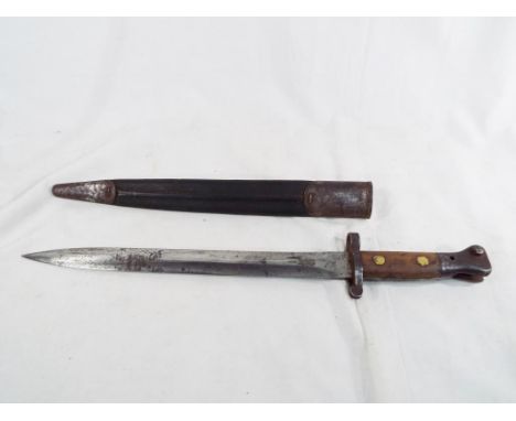 A British army bayonet and scabbard with marked EFD with a crow's foot and 66 and also a crown