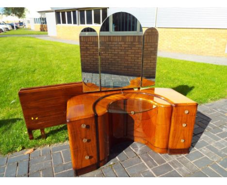 A U shaped walnut dressing table with triple mirror above with fitted glass shelf, 150 cm (h) x 128 cm (w) x 55 cm (d) and a 