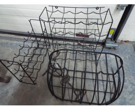 Two wall mounted wine racks, a wrought iron trough and other (4)