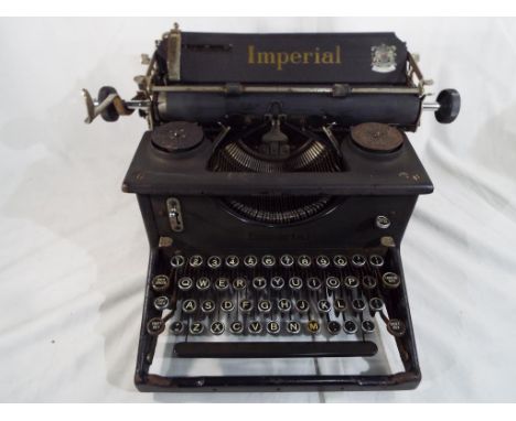 A vintage manual typewriter manufactured by Imperial