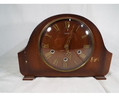 A mahogany cased mantle clock by Smiths, Westminster chimes and Roman numerals