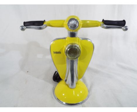 An unusual table lamp in the form of a Lambretta yellow in colour, 27cm (h) Est £40 - £60