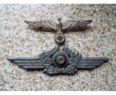 Two World War Two (WWII) German Luftwaffe metal badges comprising Cockade and Wreath cap badge, 14.5 cm (w) and Eagle with wi