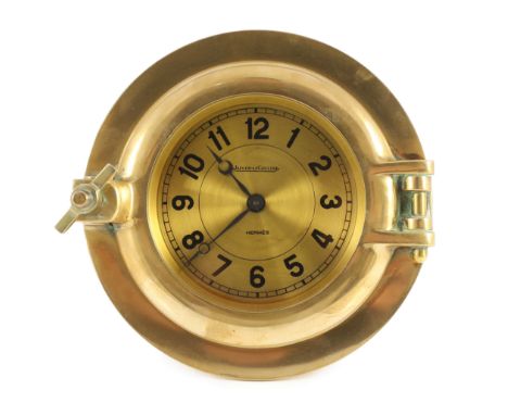 A Jaeger-Le-Coultre for Hermes novelty ship's porthole clock, circa 1955, in lacquered brass with gilt arabic dial, diameter 