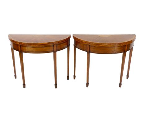 A pair of Edwardian Sheraton revival marquetry inlaid satinwood card tables the D shaped folding top inlaid with vineous moti