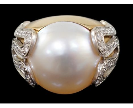 A modern Italian Versace 18ct gold and half cultured pearl set dress ring, with round brilliant cut diamond set shoulders, si