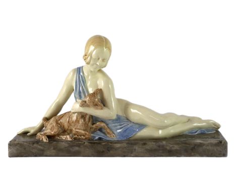 Armand Godard (French, 1824-1887). An Art Deco ceramic group of a reclining beauty with a kid, signed, impressed marks, 52.5c