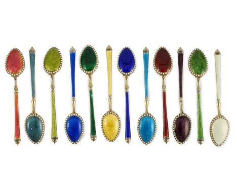 A cased set of twelve Norwegian silver gilt and polychrome enamel coffee spoons, retailed by Tiffany &amp; Co, import marks f