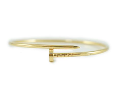 A modern 18ct gold Cartier Juste Un Clou bangle, signed, 10 grams.***CONDITION REPORT***Overall condition is good.PLEASE NOTE