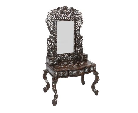 An impressive Chinese hongmu and mother of pearl inlaid dressing table, mid 20th century, the mirror frame and cresting carve