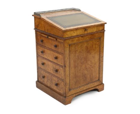 An early Victorian pollard oak davenport with writing drawer, two slides and four side drawers, 56cm wide, 57cm deep, 88cm hi