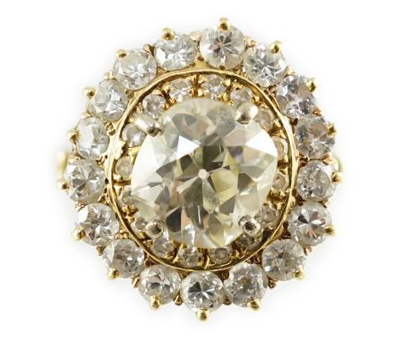 An early to mid 20th century French Van Cleef &amp; Arpels 18ct gold and diamond set oval cluster dress ring, the centre cush