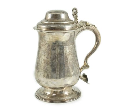 A George III silver tankard, with whistle? handle, by John King, of baluster form, with pierced thumbpiece and domed cover, L