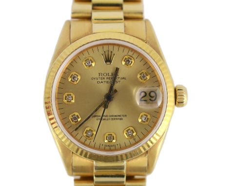 A lady's early 1970's 18ct gold Rolex Oyster Perpetual Datejust wrist watch, with diamond dot numerals, on an 18ct gold Rolex