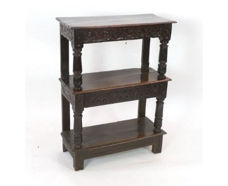 An early 17th century oak three tier buffet with mid tier drawer, turned column supports and stile feet, 88cm wide, 39cm deep